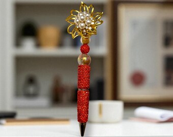 Orange Jeweled Rhinestone Pen: Delicate Golden Flower Design