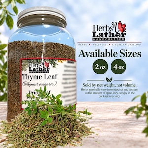 May include: A clear glass jar filled with dried thyme leaves, featuring a label that reads Herbs N Lather Thyme Leaf Thymus vulgaris. Beside the jar, text indicates available sizes of 2 oz and 4 oz, noting that the product is sold by net weight.