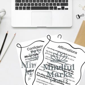 Puede incluir: Dos hojas imprimibles con texto negro y un diseño de flor de loto gris. El texto de la hoja izquierda dice "Confident the Ins" y "Mirror Talk". El texto de la hoja derecha dice "Affirmations" y "Mindful Marks".