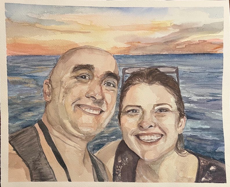 In this watercolor painting, a man and woman are smiling posing by a sunset over the water