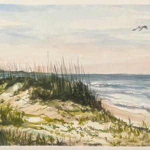 May include: Watercolor painting of a beach scene with sand dunes, tall grass, and the ocean under a pastel sky. Two birds are flying in the distance. The artwork uses soft colors and brushstrokes to depict a serene coastal landscape.