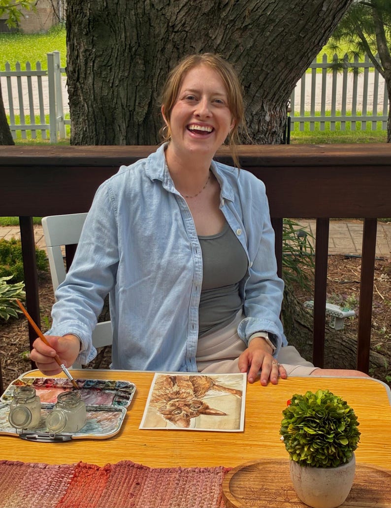 this is a picture of the artist, Bri, painting outside
