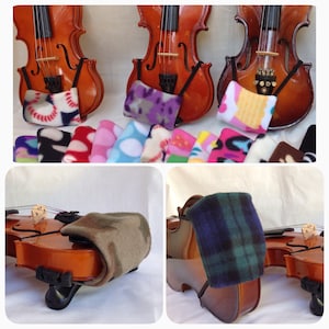 May include: A set of colorful fleece violin shoulder rests. The rests are made of soft, comfortable fleece and come in a variety of colors and patterns. The rests are designed to help violinists find a comfortable playing position.