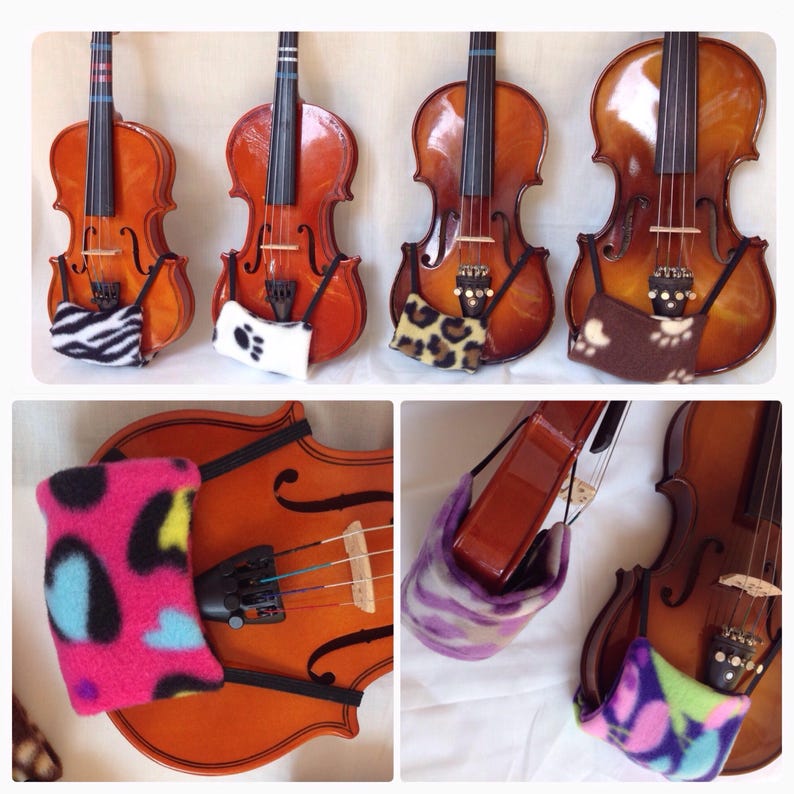 Puede incluir: Cinco violines con diferentes almohadillas de vell&oacute;n de colores fijadas al reposacabezas. Las almohadillas son de varios estampados de animales, incluyendo cebra, huellas de patas, leopardo y camuflaje.