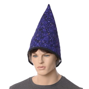 May include: A purple wizard hat with a black trim and a swirling galaxy pattern. The hat is made of fabric and has a pointed top.