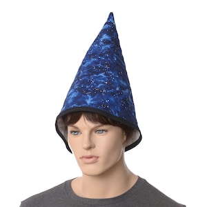 May include: A blue wizard hat with a black trim and a galaxy print. The hat is made of fabric and has a pointed top.