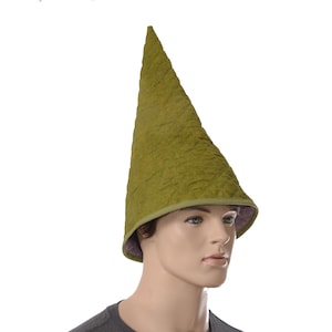 May include: A tall, pointed cone-shaped hat in a textured olive green fabric. The hat features a quilted pattern across the exterior surface and a solid olive green trim along the bottom edge, with a visible purple lining on the interior underside.
