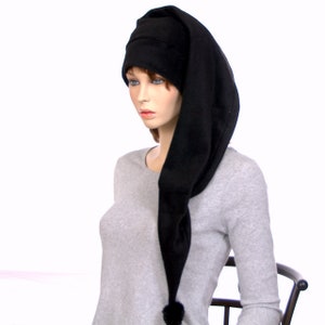 May include: A black fleece sleep cap with a long, pointed tail and a small pom-pom at the end.
