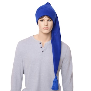 May include: A vibrant blue sleep hat with a long, pointed tip and a tassel. The hat is made of a soft fabric and is worn by a mannequin. The mannequin is wearing a grey long-sleeved shirt.