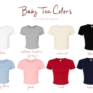 May include: A collection of eight short-sleeved crew neck t-shirts in white, athletic heather gray, natural, black, baby blue, pink, red, and navy. The text reads Baby Tee Colors and 52% cotton, 48% polyester. Each shirt is displayed individually.
