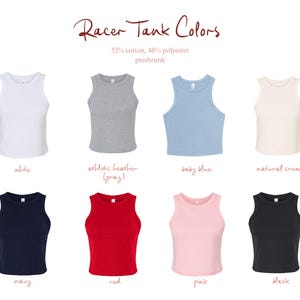 May include: A collection of eight racerback tank tops in white, athletic heather gray, baby blue, natural creme, navy, red, pink, and black. The text reads Racer Tank Colors, 52% cotton, 48% polyester, preshrunk, with labels for each color.
