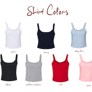 May include: A collection of seven sleeveless tank tops arranged in two rows, labeled with the text Shirt Colors. The colors include white, navy, baby blue, black, athletic heather, red, and pink. Each top features a scoop neckline and wide straps.