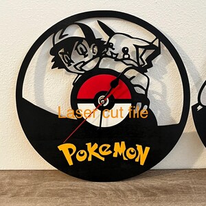 May include: Black laser-cut wall clock featuring a Pokemon theme. The clock face includes a red and white Pokeball design, with Ash and Pikachu silhouettes. The word "Pokemon" is in yellow, and the clock hands are red.