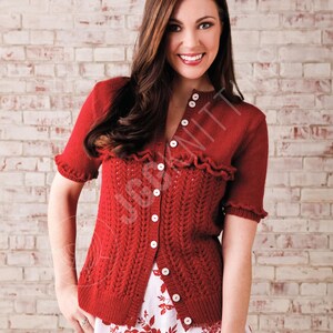 May include: A short-sleeved, deep red knit cardigan featuring a vertical openwork pattern, a ruffled yoke detail, and a front button closure. The garment has a round neckline and ribbed cuffs on the sleeves, with a visible watermark text JGSKNITS.