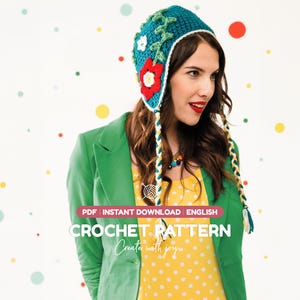 May include: A teal crochet hat featuring a white trim, green vine accents, and red and white flower appliqués. The hat includes two long, braided ties in yellow, white, and teal. Text on the image reads: PDF INSTANT DOWNLOAD ENGLISH CROCHET PATTERN Create with joy.