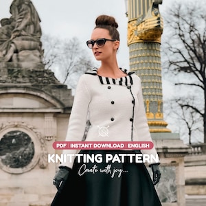 May include: A white double-breasted knit jacket with a black and white striped collar, long sleeves, and black buttons. The image includes text that reads: PDF INSTANT DOWNLOAD ENGLISH KNITTING PATTERN Create with joy.