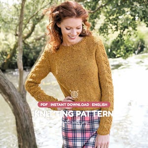 May include: A mustard yellow long-sleeve sweater with a textured knit pattern on the sleeves and a round neckline. The image includes text that reads PDF INSTANT DOWNLOAD ENGLISH KNITTING PATTERN create with joy.