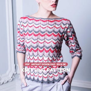 May include: A long-sleeved knit sweater featuring a repeating chevron pattern in shades of red, light pink, and dark gray. The garment has a boat neckline and a scalloped hem. Text on the image reads: PDF INSTANT DOWNLOAD EN & DE KNITTING PATTERN.