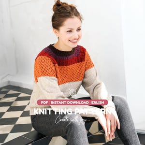 May include: A long-sleeve sweater featuring a color-blocked design with a dark brown collar, a deep red upper chest, a textured orange mid-section, and a beige lower body. Text reads: PDF INSTANT DOWNLOAD ENLISH KNITTING PATTERN Create with joy.