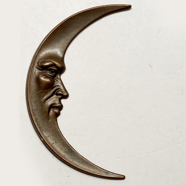 vintage man in the moon sliver of a crescent copper casting