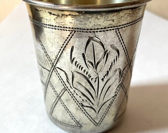 antique sterling silver shot glass with incised village and floral motifs
