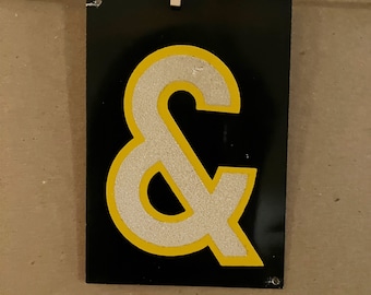 vintage reflective metal ampersand sign &