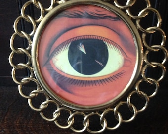 solid brass link frame with copy of oculist eye