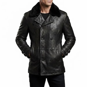 May include: A black leather jacket with a double-breasted design and a black fur collar. The jacket has two rows of buttons, two front pockets, and adjustable cuffs. The jacket is worn by a person.