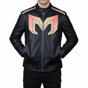 May include: Black leather jacket with a stand-up collar and a full-length zipper. The jacket features a large, stylized "M" design on the chest in shades of orange and yellow. The shoulders have matching orange and yellow accents.