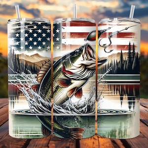 May include: Three stainless steel tumblers with a patriotic American flag design and a largemouth bass jumping out of the water. The tumblers have lids and straws.