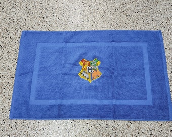 Harry Potter Hogwarts 4 House Shield on Electric Blue Embroidered Bath Mat - Embroidered Directly on Bath Mat