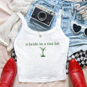 a bride in a tini bit tank top | bridal tees and tanks | bachelorette party tanks | engagement gifts | bride to be gift