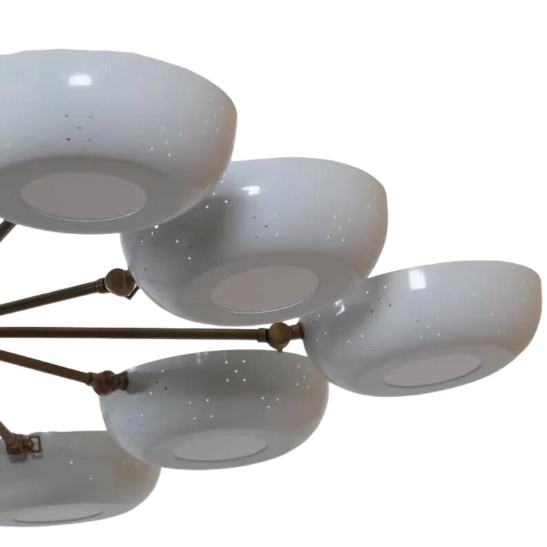 May include: A modern chandelier featuring multiple white, bowl-shaped shades with small perforations. The shades are attached to a bronze-colored frame. The light fixtures are arranged in a multi-tiered design, suitable for home decor.