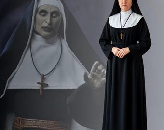May include: A black and white nun's habit with a cross pendant. The outfit features a long black dress, a white collar, and a black veil. A figure of a demonic nun is in the background.