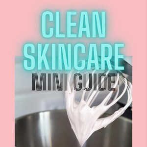 May include: A pink background with the text "CLEAN SKINCARE MINI GUIDE" in blue and black text. Below the text is a photo of a white substance being whipped in a silver bowl with a silver whisk.