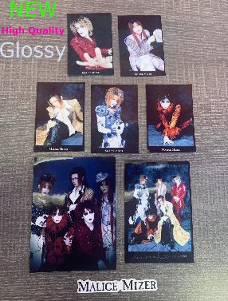 May include: Six glossy photo cards featuring a Japanese rock band, Malice Mizer. The cards feature black and white photos of the band members in various poses. The band's name is printed in white letters on a black background at the bottom of the cards.