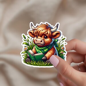 Highland Cow Reading Sticker – 2 Inch Water-Resistant Vinyl Sticker, Cute Cow Decal for Water Bottles, Laptops, Journals, E-Readers and More
