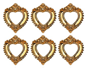 May include: Six ornate, heart-shaped picture frames with a gold finish. Each frame features intricate floral and scroll detailing around the edges. The frames are arranged in two rows of three, showcasing their decorative design.