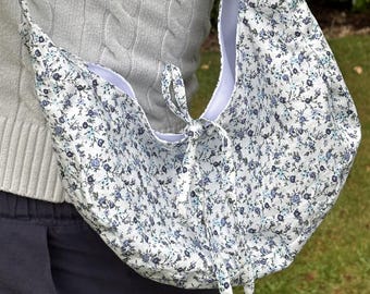 Handmade floral shoulder bags.
