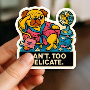 May include: A sticker featuring a cartoon pug wearing a pink robe, sitting on a small wooden chair, and fanning itself with its paw. A small fan is next to the pug. The text on the sticker reads "CAN'T. TOO DELICATE."