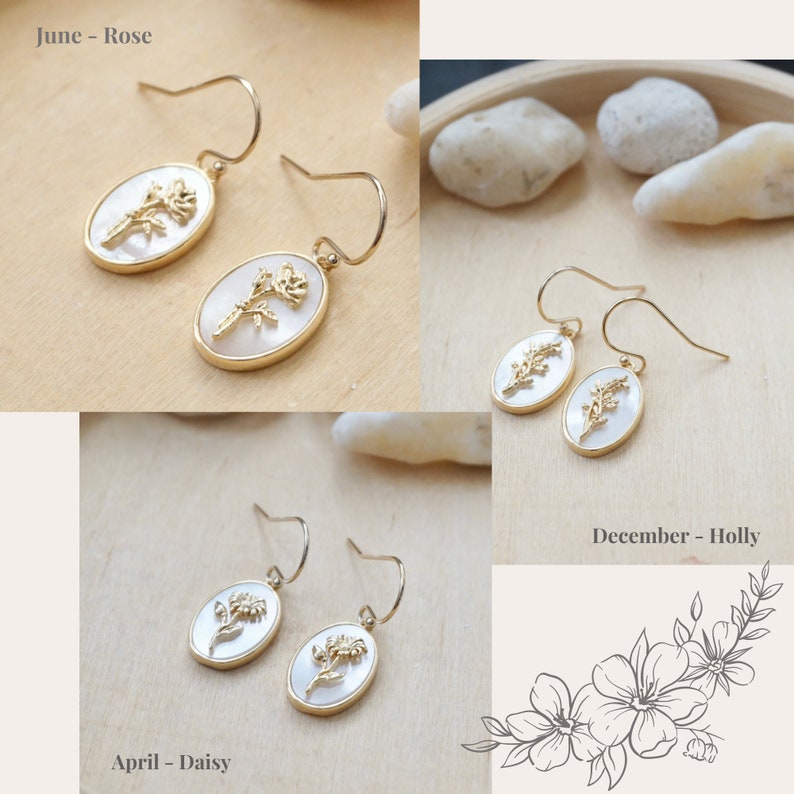 May include: A set of gold earrings with white oval-shaped stones featuring floral designs. The earrings are labeled "June - Rose", "April - Daisy", and "December - Holly".