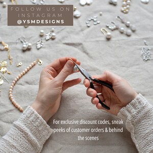 May include: A person using pliers to work on a pearl earring. The image shows various jewelry pieces, including pearl necklaces and earrings, scattered on a neutral-colored surface. Text in the image reads "FOLLOW US ON INSTAGRAM @YSMDESIGNS".