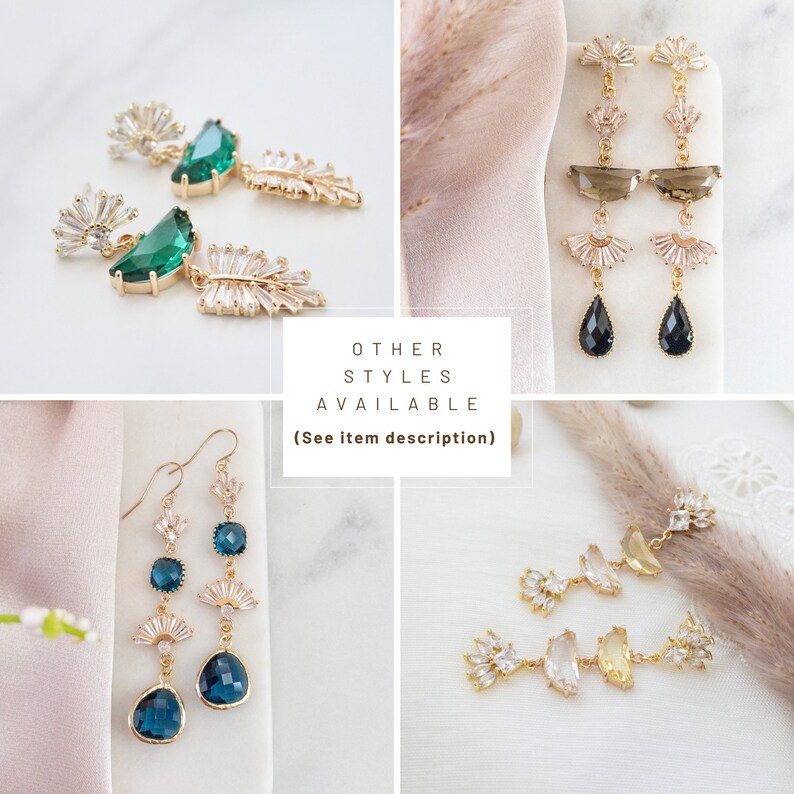 May include: Four pairs of dangle earrings with crystal accents. The earrings feature different colored stones, including green, blue, black, and yellow.  OTHER STYLES AVAILABLE (See item description)