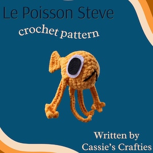 May include: A crochet pattern for a cute orange fish named Le Poisson Steve, written by Cassie's Crafties. The fish has a big eye and a small mouth.