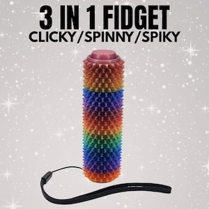 May include: A rainbow-coloured fidget toy with a spiky texture. The text "3 IN 1 FIDGET CLICKY/SPINNY/SPIKY" is displayed at the top. A black wrist strap is attached to the bottom. The toy has a clicky, spinny, and spiky design.