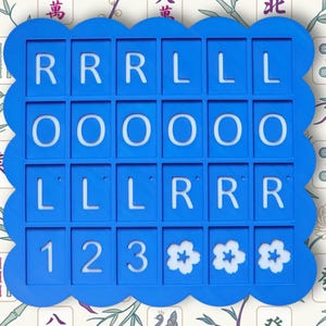 May include: A blue, scalloped-edge game board with white letters and numbers. The letters spell out "RRRLLLOOOLLLRRR" and the numbers are "123". Three white flower designs are at the bottom. The background has a floral and Chinese character pattern.