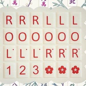 May include: A set of white Mahjong tiles with red characters and symbols, arranged in a scalloped frame. The tiles display letters, numbers, and floral designs. The background features a floral and bamboo pattern.