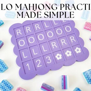 May include: A purple mahjong practice board with white letter tiles and flower symbols. The board is surrounded by colorful mahjong tiles in shades of blue, pink, and purple. Text at the top reads: SOLO MAHJONG PRACTICE MADE SIMPLE.