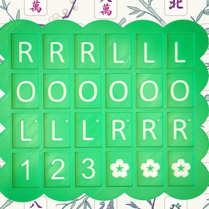 May include: A green, scalloped-edged game board with white letters and numbers. The letters spell out "RRRLLLOOOLLLRRR" and the numbers are "123". Three white flower symbols are at the bottom. The background has a floral and bamboo pattern.