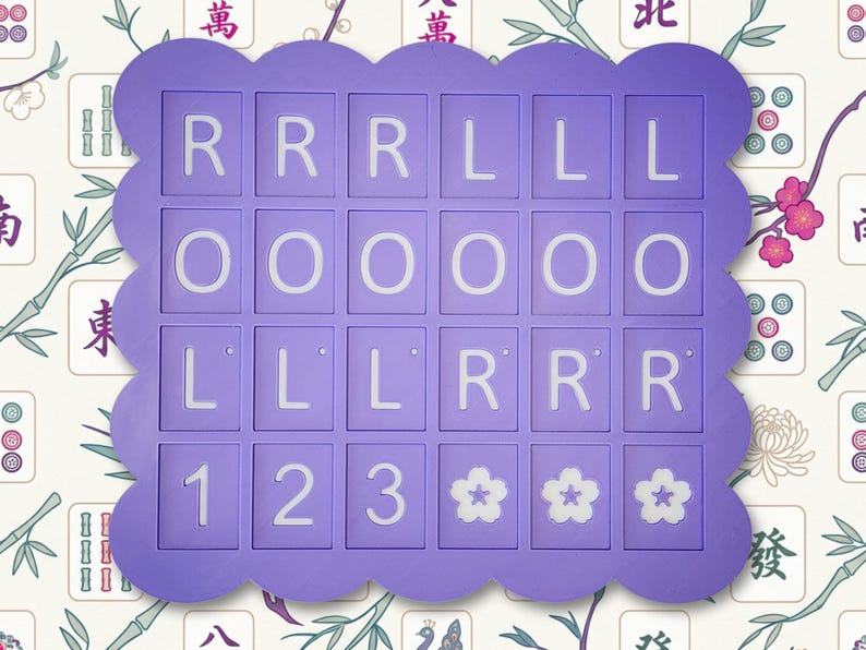 May include: A purple Mahjong tile holder with a scalloped edge. The holder contains tiles with the letters R, L, and O, numbers 1, 2, and 3, and flower symbols. The background features a floral and bamboo pattern.